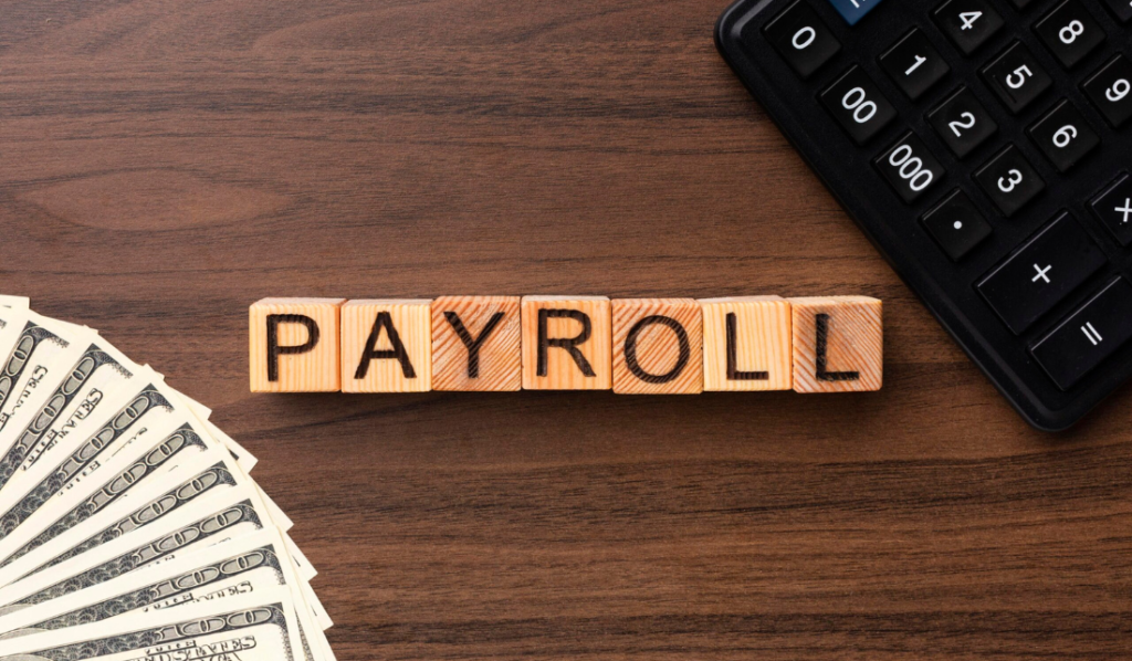 Palavras em blocos de madeira com a palavra 'PAYROLL'